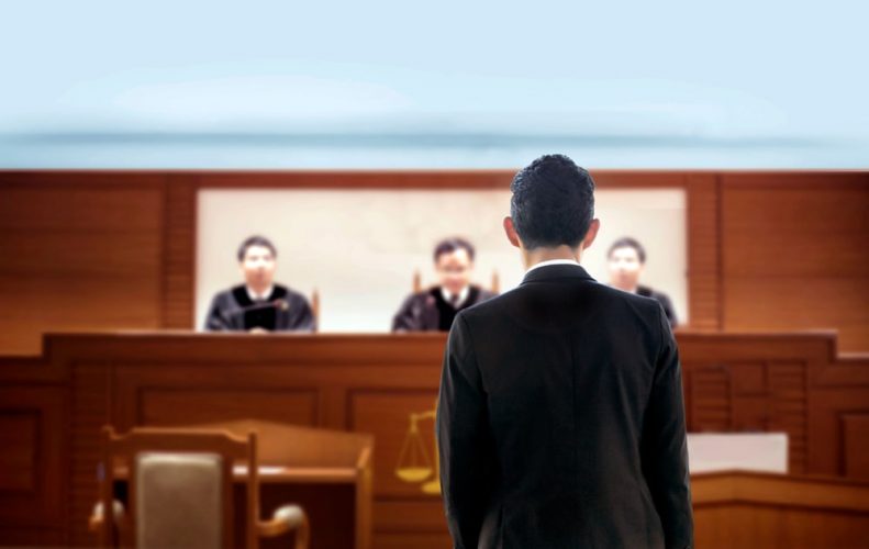 Man in front of Judges